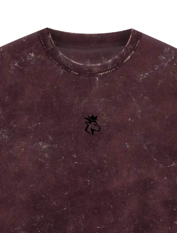 Maroon Acid Wash t-shirt with a small GOATED logo embroidery on the chest area.
