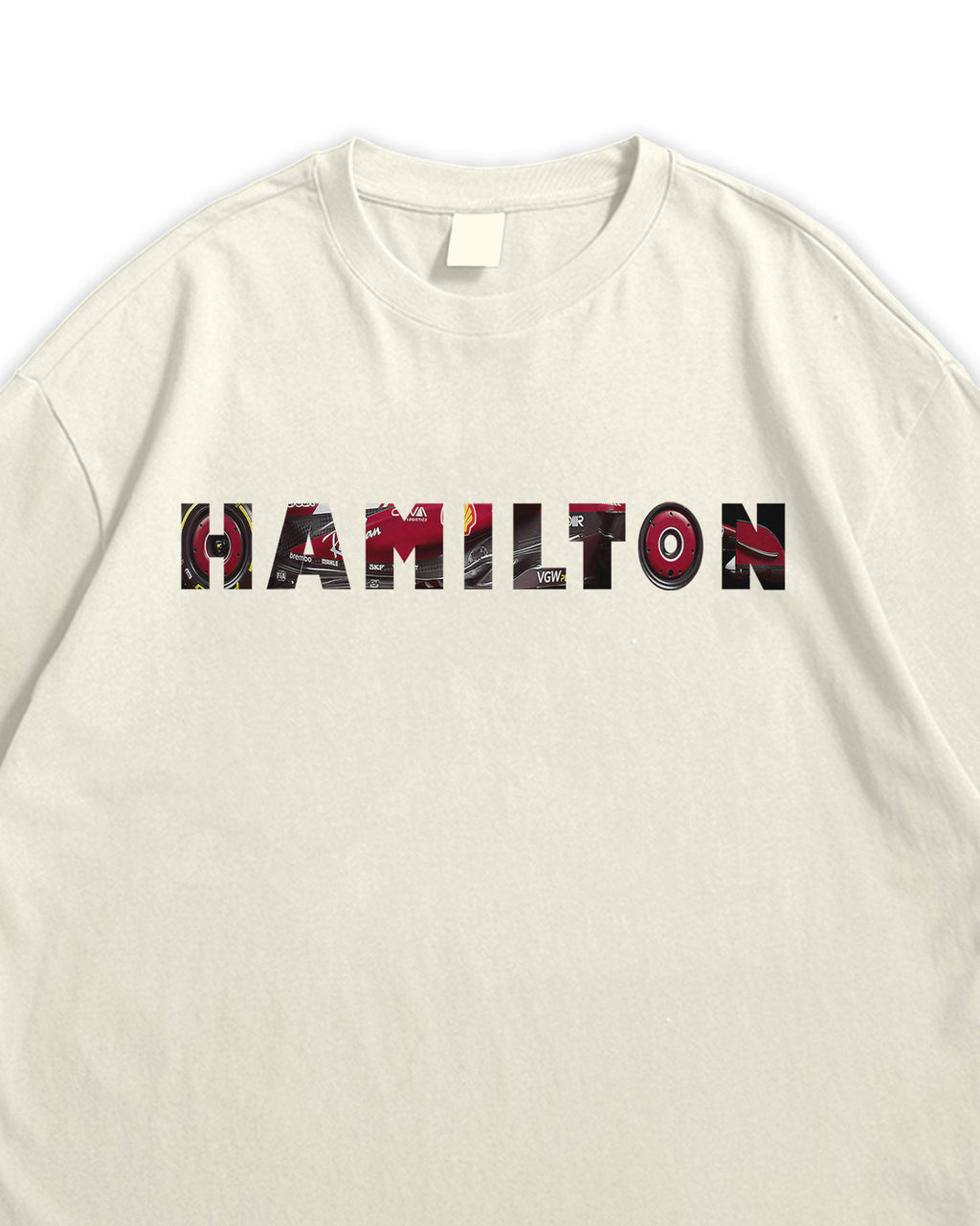 Beige t-shirt with 'HAMiLTON' printed in colorful letters on a white background