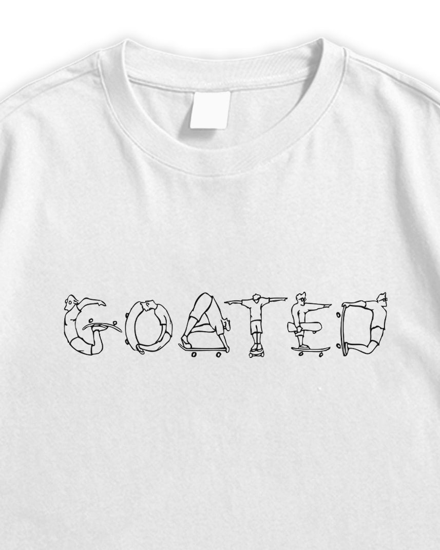 White t-shirt with black GOATED graphic design on a white background