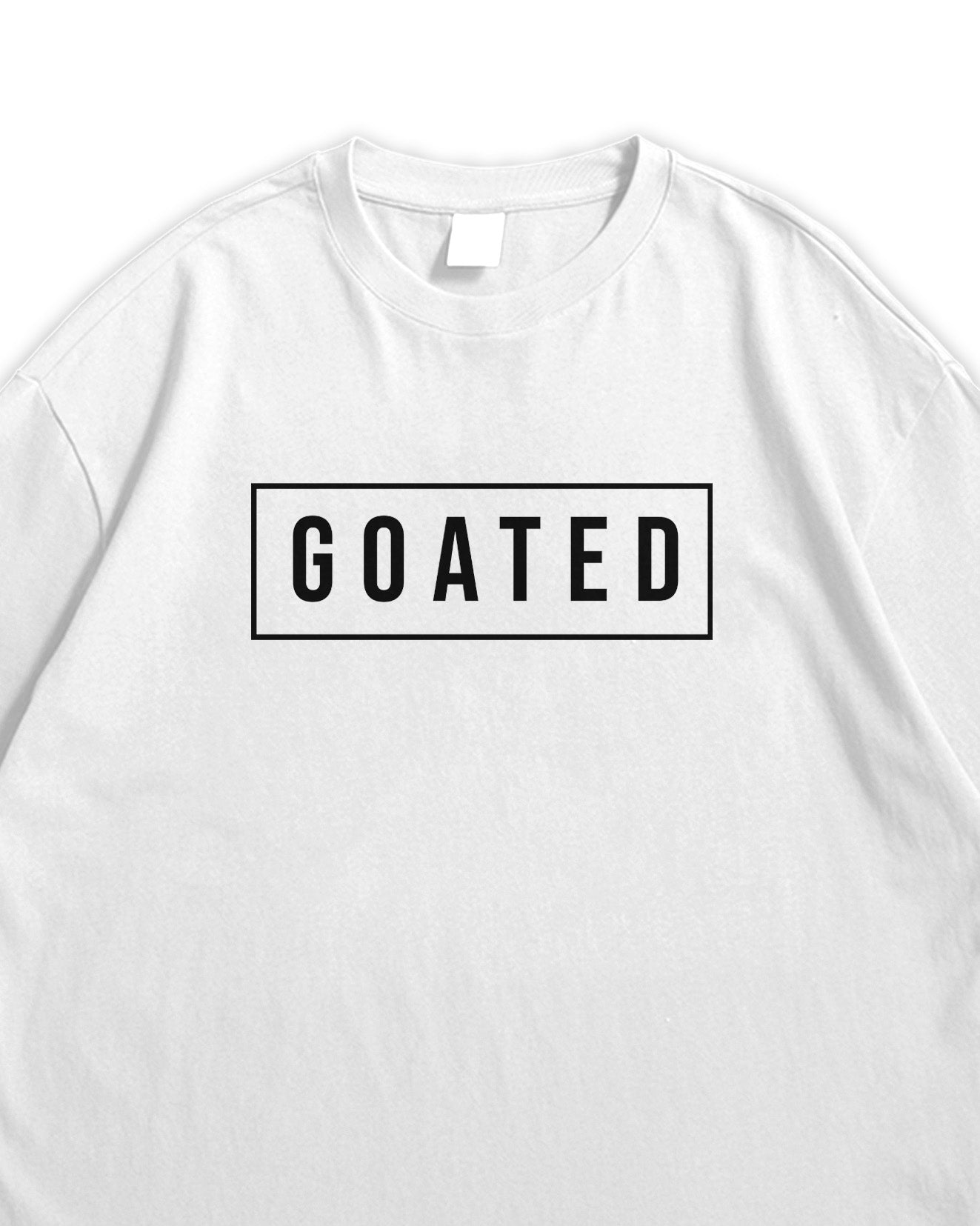 White t-shirt with 'GOATED' text on a white background