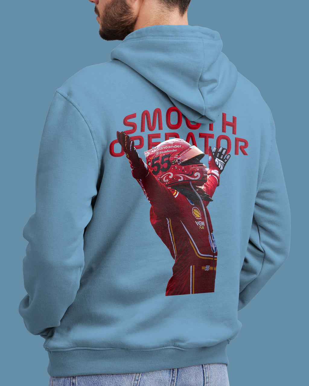 Light blue hoodie with a graphic of Carlos Sainz in ferrari racing suit and helmet, and the text 'Smooth Operator' on the back.